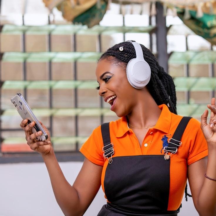 Ava Reed, Lead Design Curator at Pine Brook Harbor, reviewing corporate floral arrangements